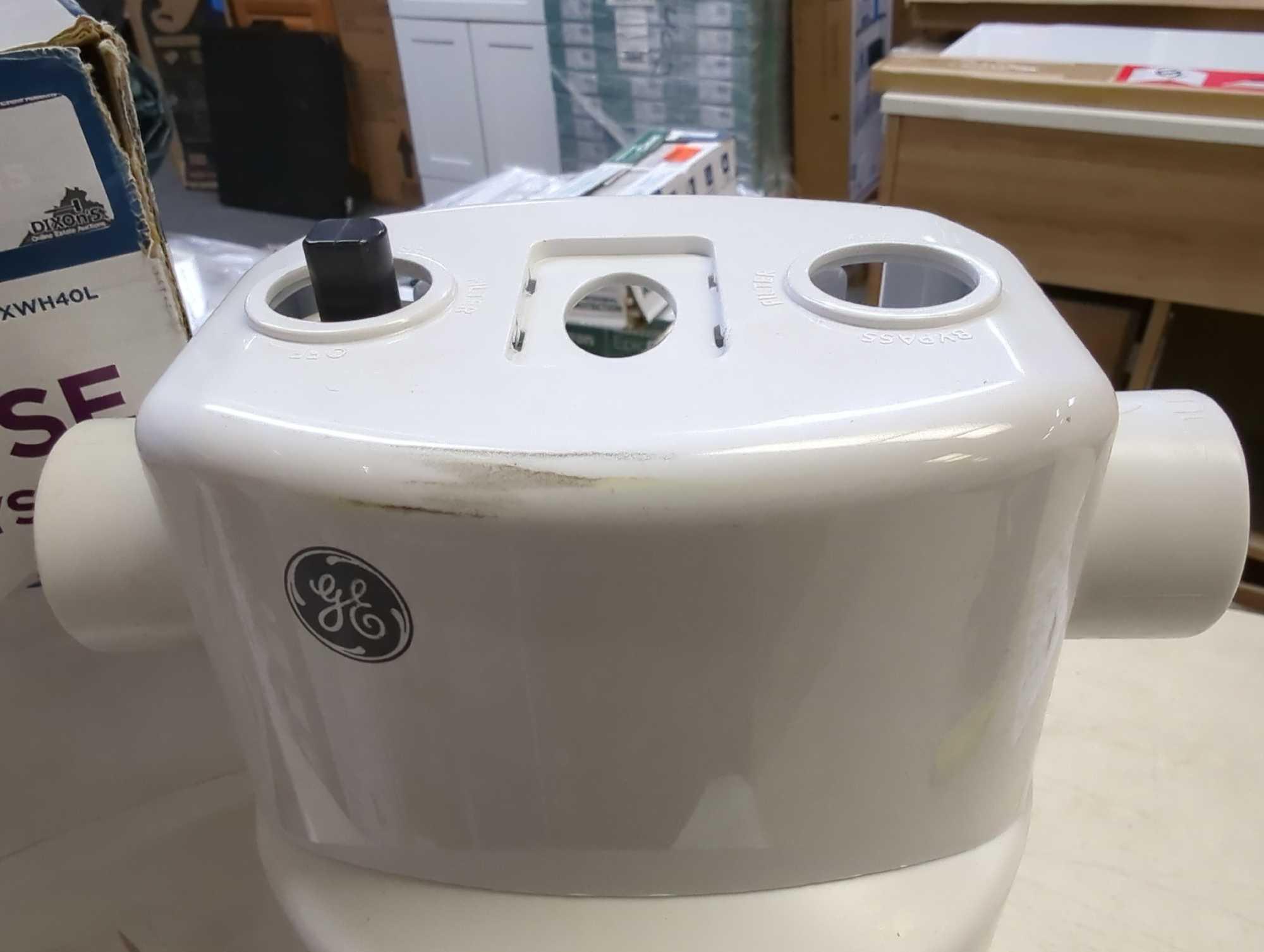 GE Whole House Water Filtration System. Comes in opened box as is shown in photos. Appears to be