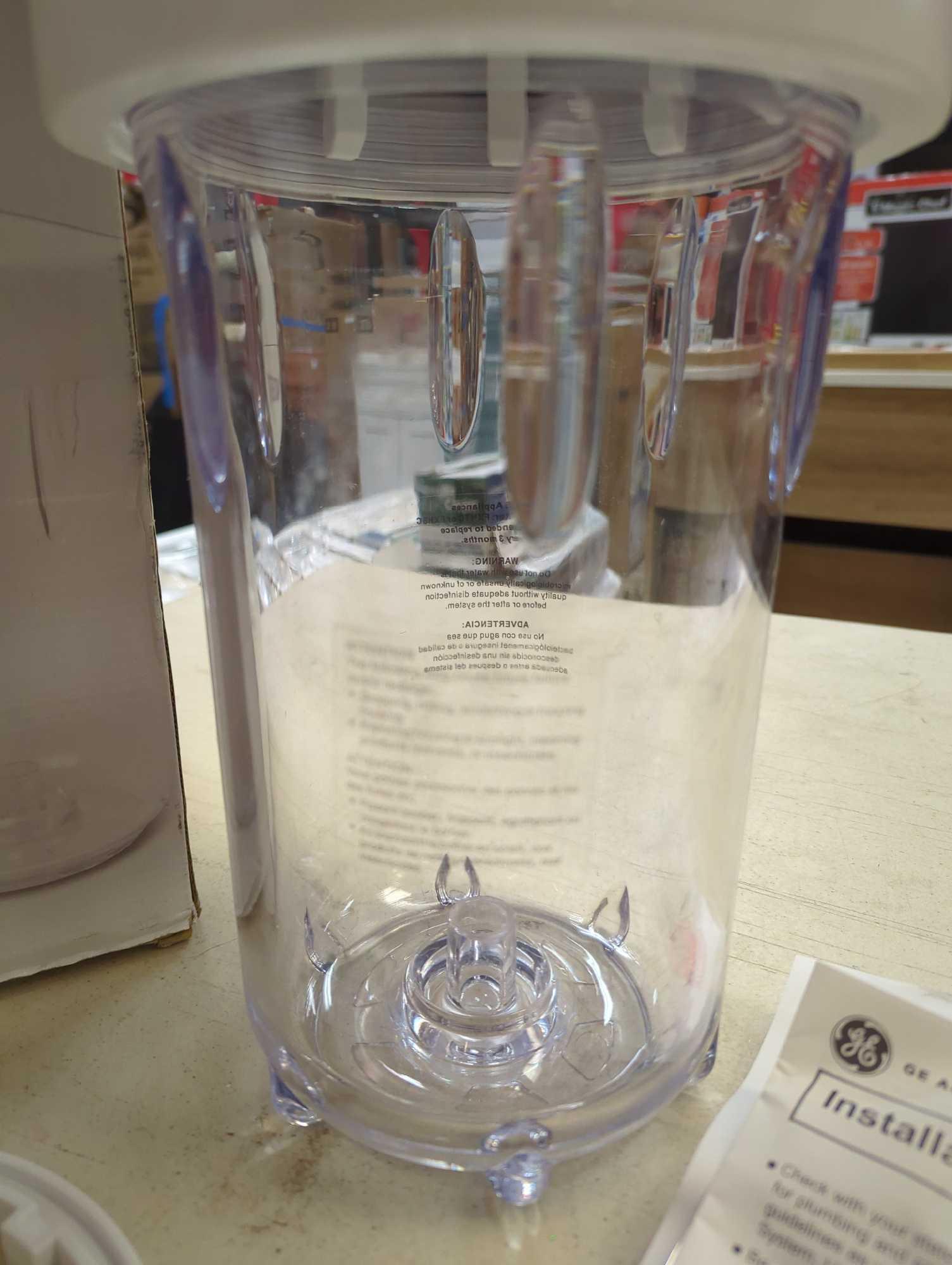 GE Whole House Water Filtration System. Comes in opened box as is shown in photos. Appears to be
