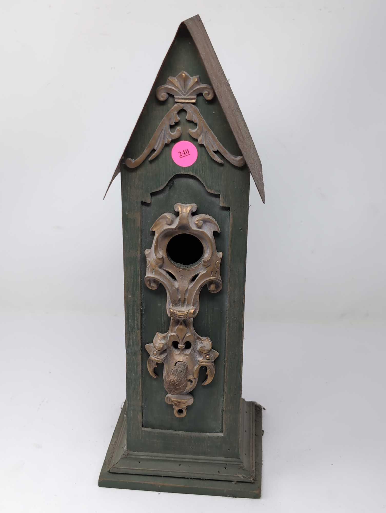 (LR) COUNTRY THEMED GREEN WOOD BIRD HOUSE WITH GOLD DETAILED ENTRYWAY AND TIN ROOF. IT MEASURES