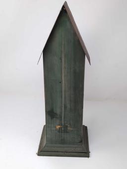 (LR) COUNTRY THEMED GREEN WOOD BIRD HOUSE WITH GOLD DETAILED ENTRYWAY AND TIN ROOF. IT MEASURES