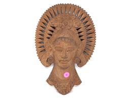 (FOYER) ORNATE BALI WOOD CARVED WALL HANGING OF A PRINCESS'S HEAD. IT MEASURES APPROX. 12"T X 8"W.