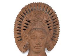 (FOYER) ORNATE BALI WOOD CARVED WALL HANGING OF A PRINCESS'S HEAD. IT MEASURES APPROX. 12"T X 8"W.