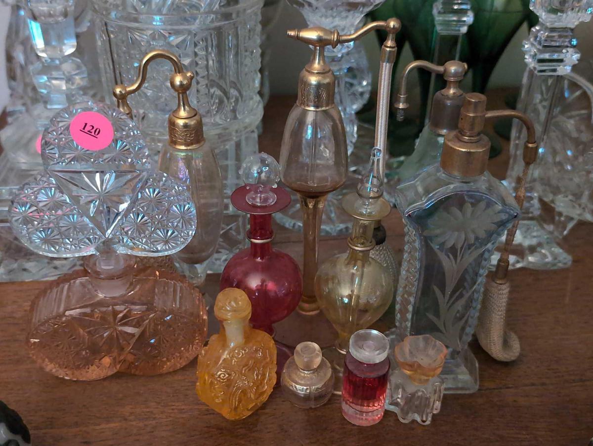 (LR) LOT OF (11) VINTAGE VARIOUS SIZED COLORED AND CLEAR GLASS PERFUME BOTTLES.