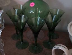 (LR) 7 PC. VINTAGE GREEN GLASS DECANTER AND STEMWARE SET. DECANTER IS 11"T X 5"T.