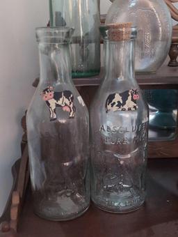 (LR) 4 PC. LOT TO INCLUDE A PAIR OF ABSOLUTE MILK GLASS MILK BOTTLES, TORAH GLASS BOTTLE WITH WHITE