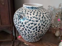 (LR) LARGE ORIENTAL BLUE AND WHITE FLORAL DETAILED PORCELAIN FLOWER VASE. MARKED ON THE BOTTOM.