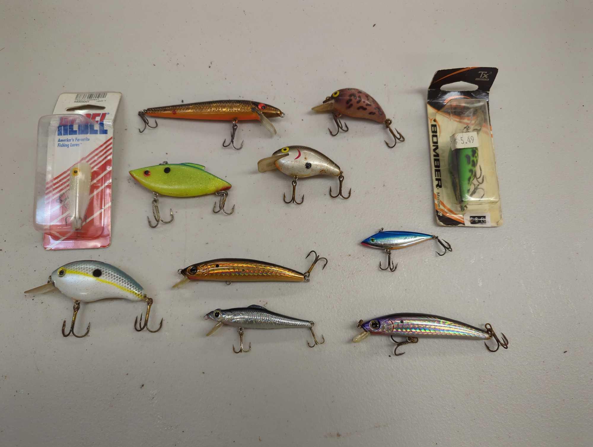 Tackle Box and contents including various fishing lures of similar style. Comes as is shown in