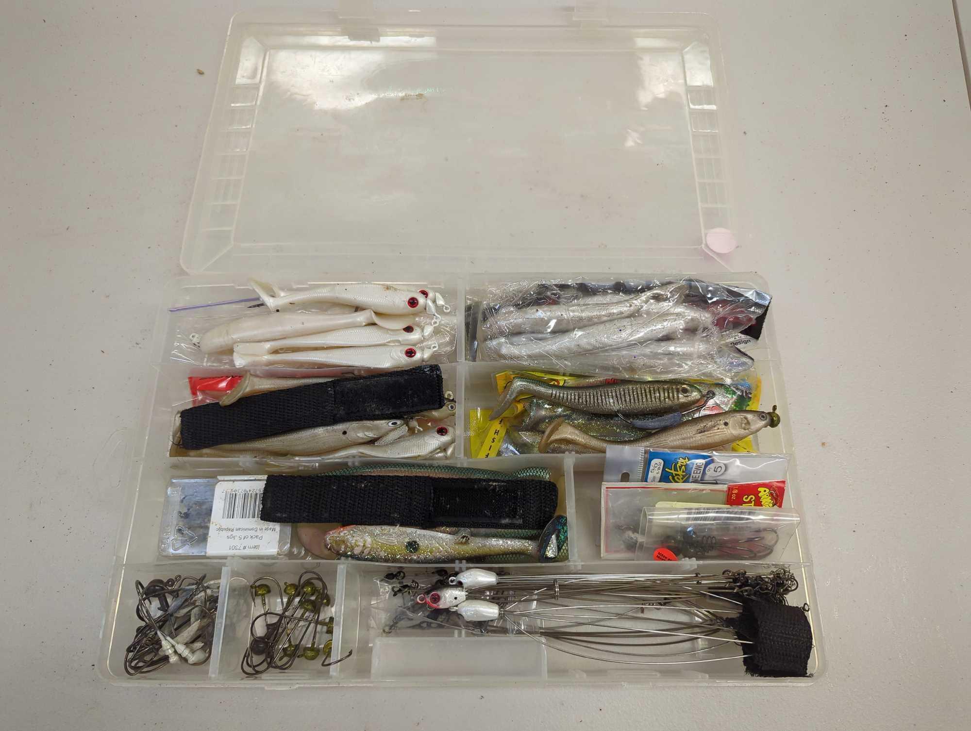 Tackle Box and contents including various fishing lures and other fishing accessories. Comes as is