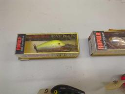 Tackle Box and contents including various fishing lures of similar style. Comes as is shown in