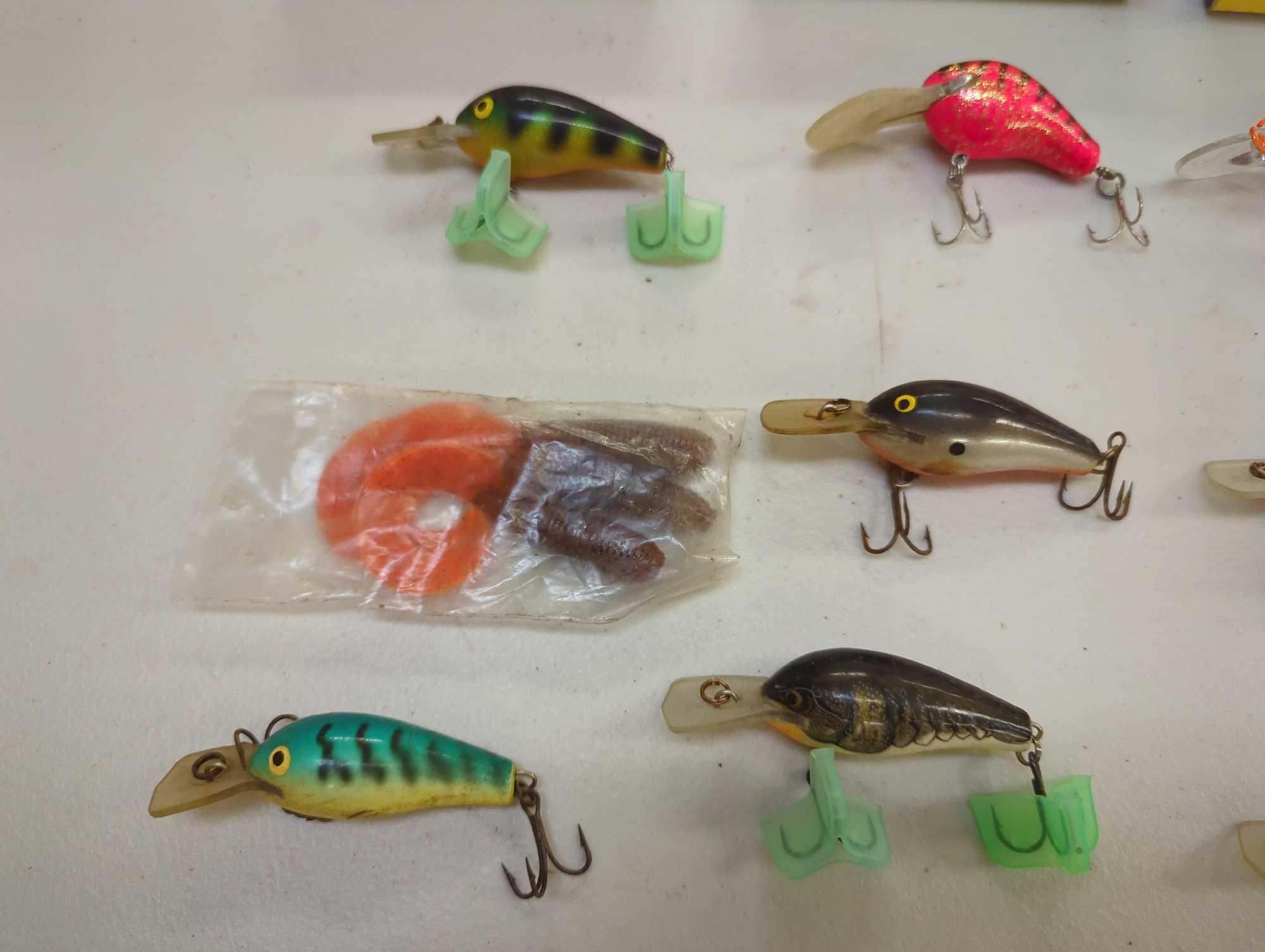 Tackle Box and contents including various fishing lures of similar style. Comes as is shown in