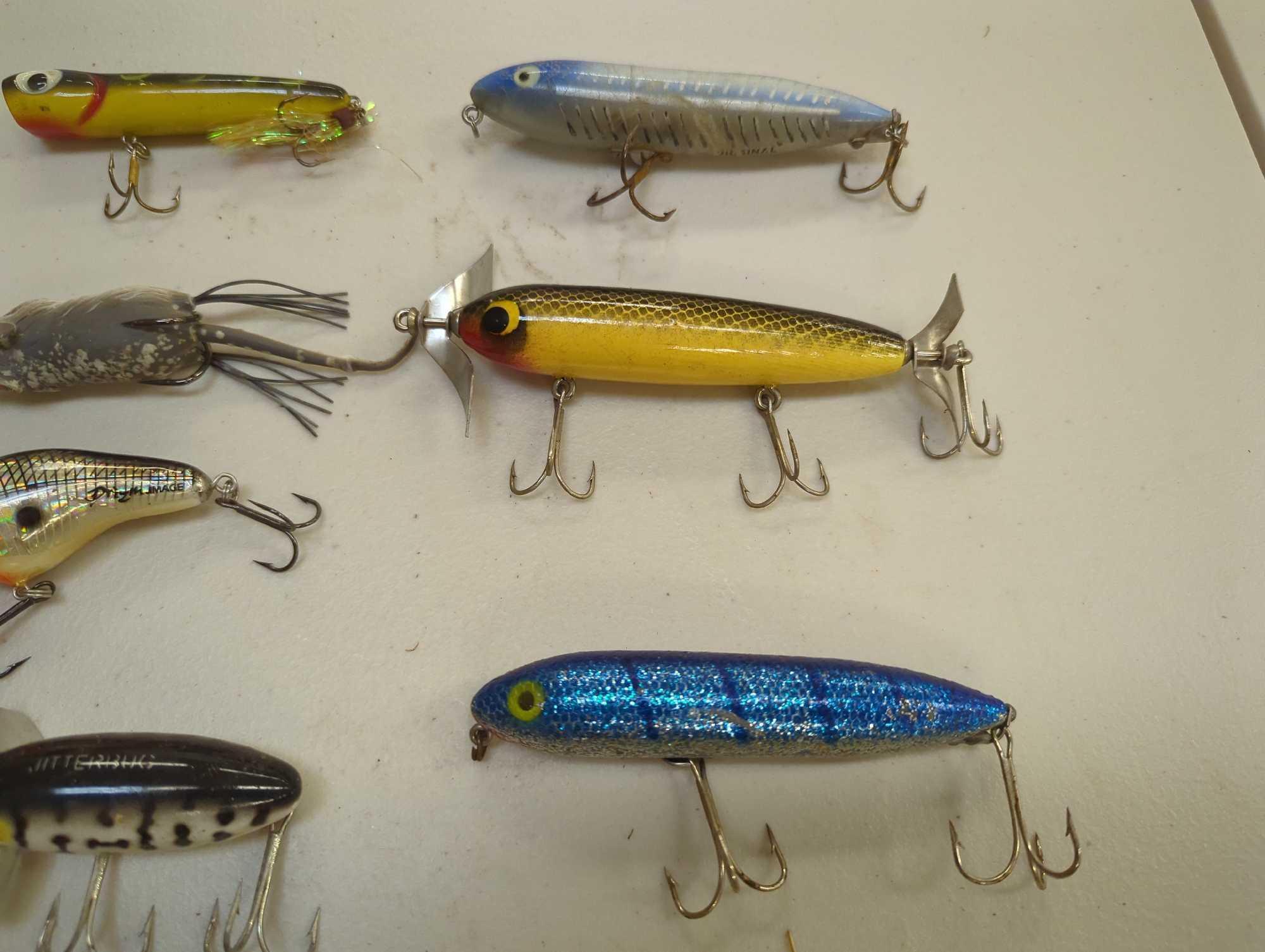 Tackle Box and contents including various fishing lures of similar style. Comes as is shown in