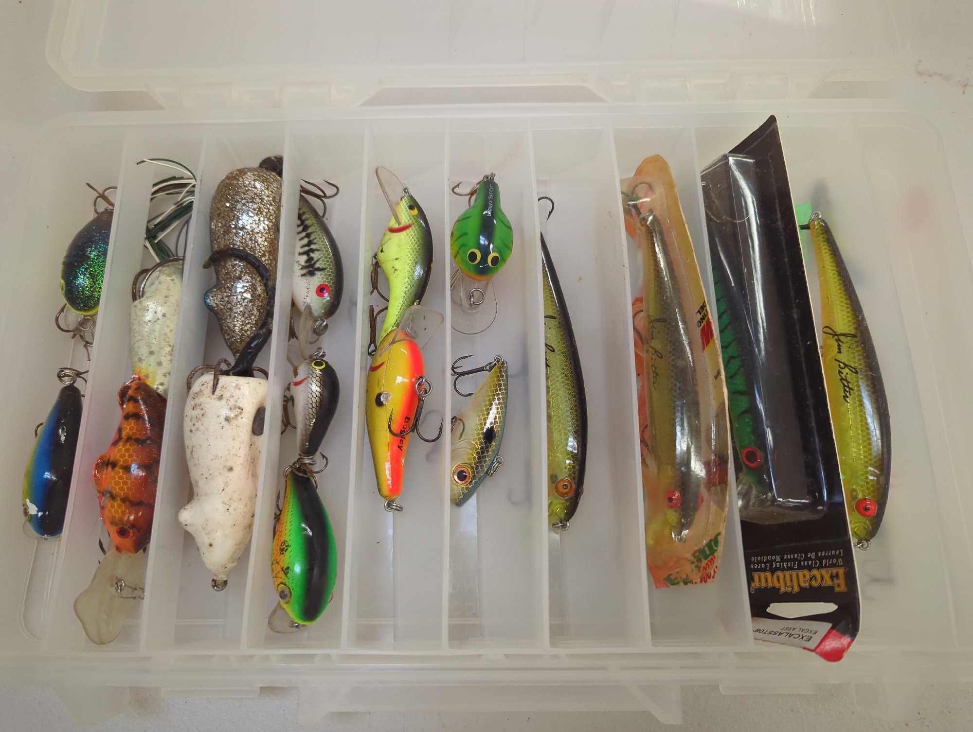 Tackle Box and contents including various fishing lures of similar style. Comes as is shown in