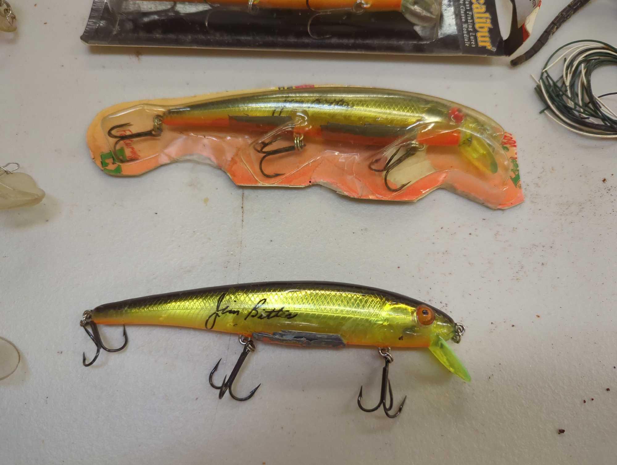 Tackle Box and contents including various fishing lures of similar style. Comes as is shown in