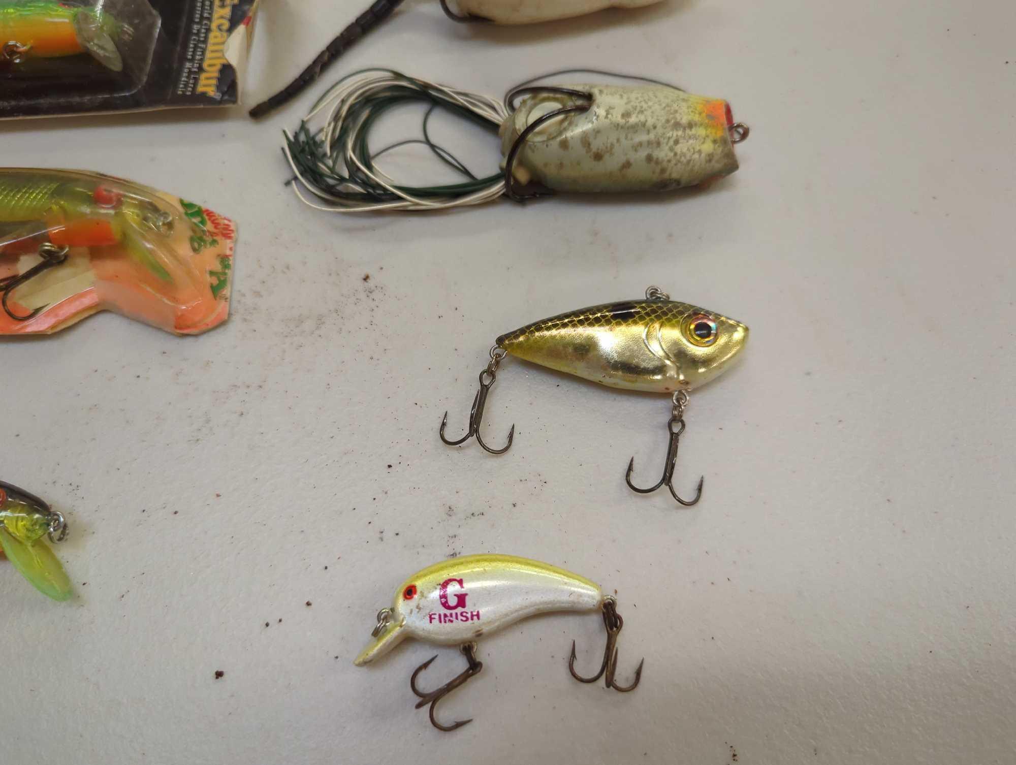 Tackle Box and contents including various fishing lures of similar style. Comes as is shown in