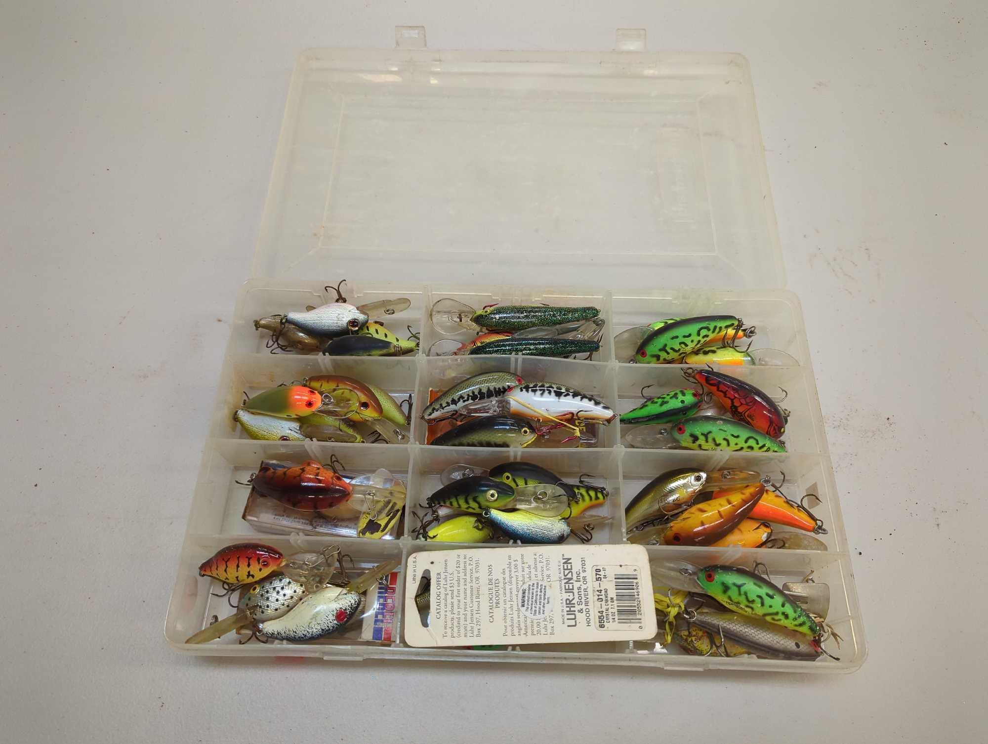 Tackle Box and contents including various fishing lures of similar style. Comes as is shown in