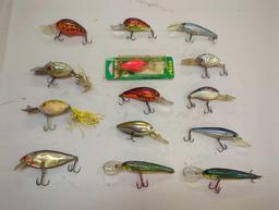 Tackle Box and contents including various fishing lures of similar style. Comes as is shown in