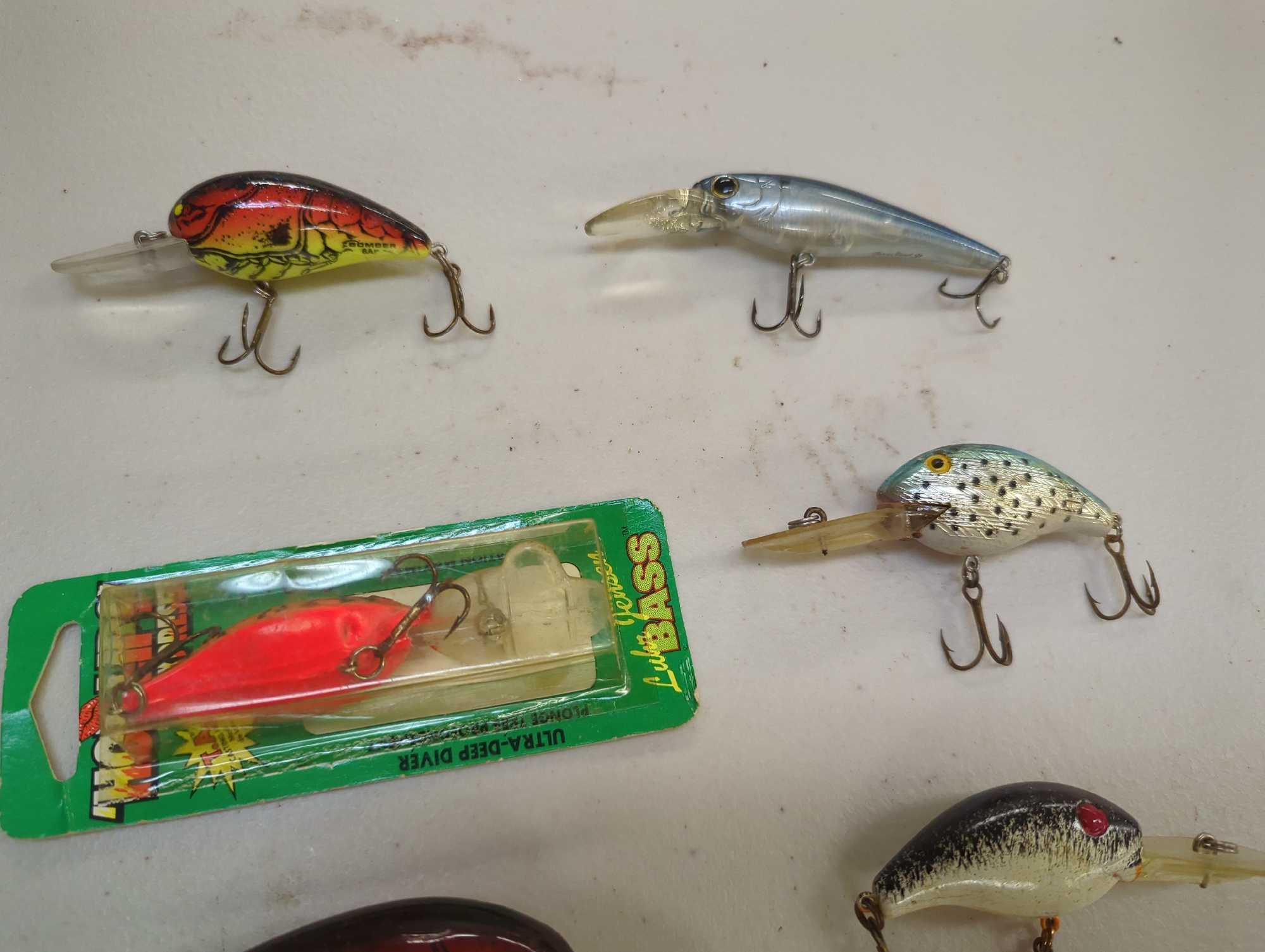 Tackle Box and contents including various fishing lures of similar style. Comes as is shown in