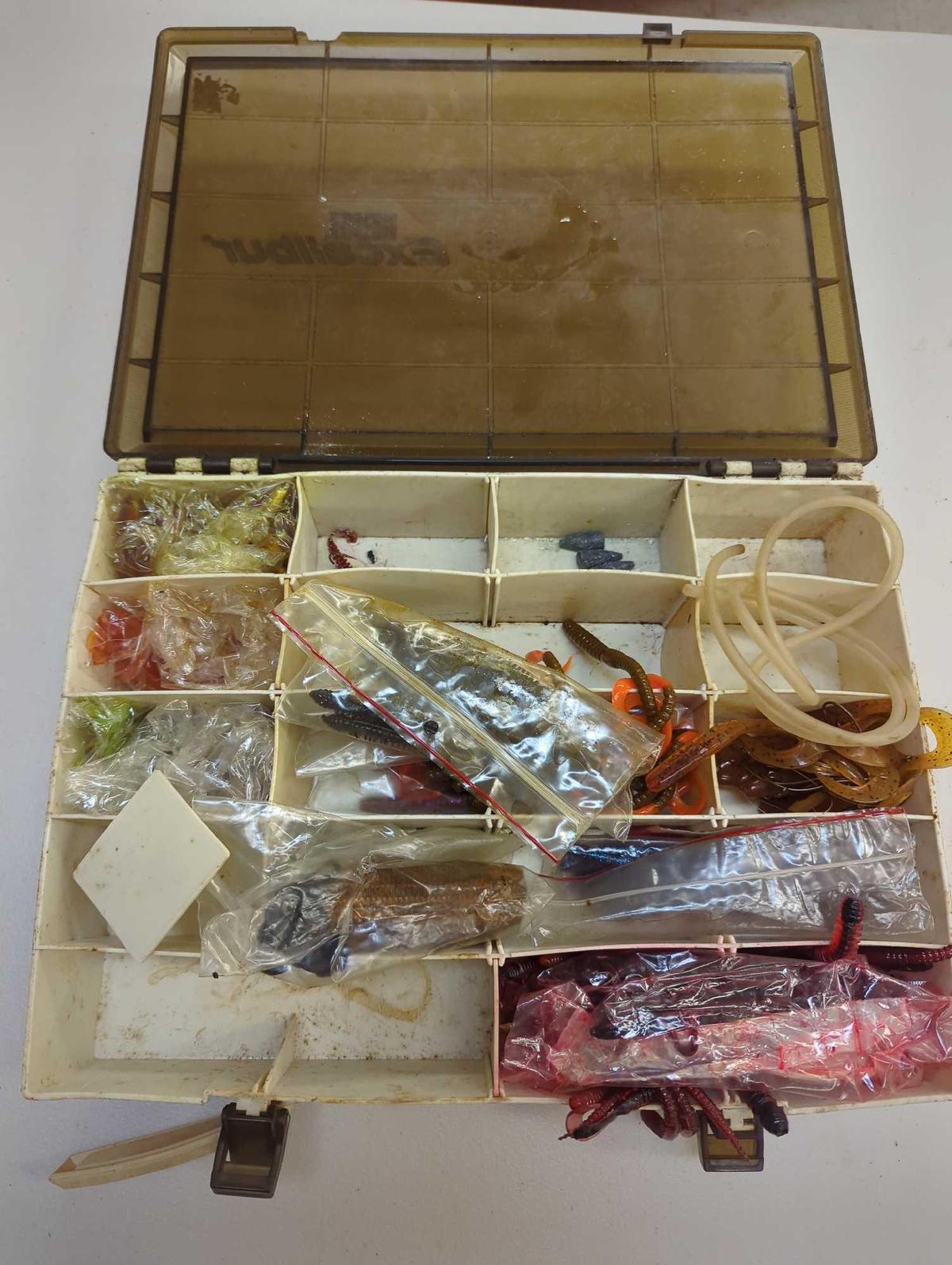 Tackle Box and contents including worms and various fishing lures. Comes as is shown in photos.