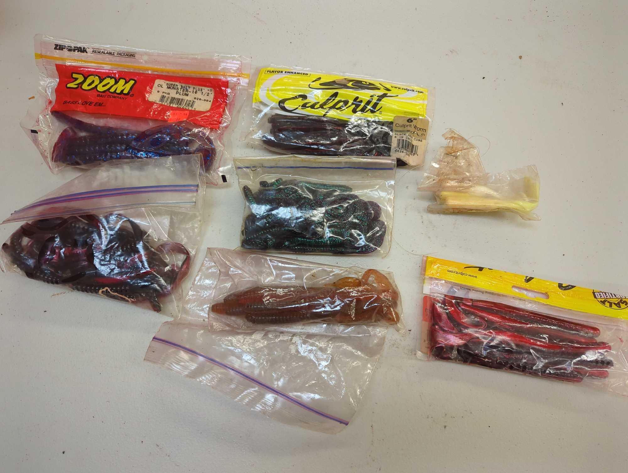 Christmas tote and contents including various worm fishing lures. Comes as is shown in photos.