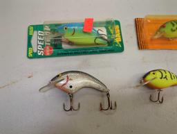 Tackle Box and contents including various fishing lures of similar style. Comes as is shown in