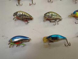 Tackle Box and contents including various fishing lures of similar style. Comes as is shown in