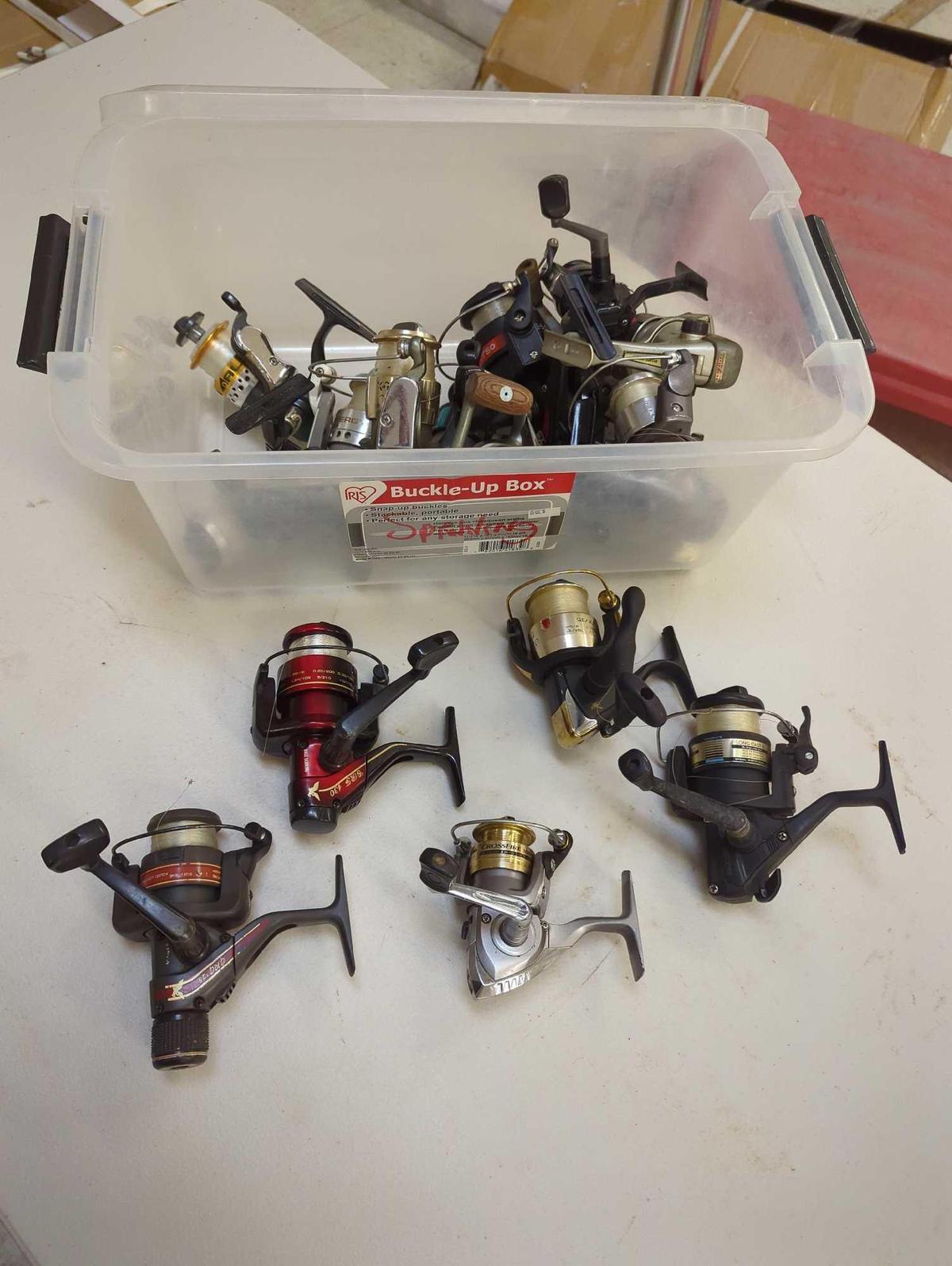 Clear tote and contents including various spinning reels. Comes as is shown in photos. Appears to be