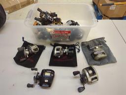 Clear tote and contents including various spinning reels. Comes as is shown in photos. Appears to be