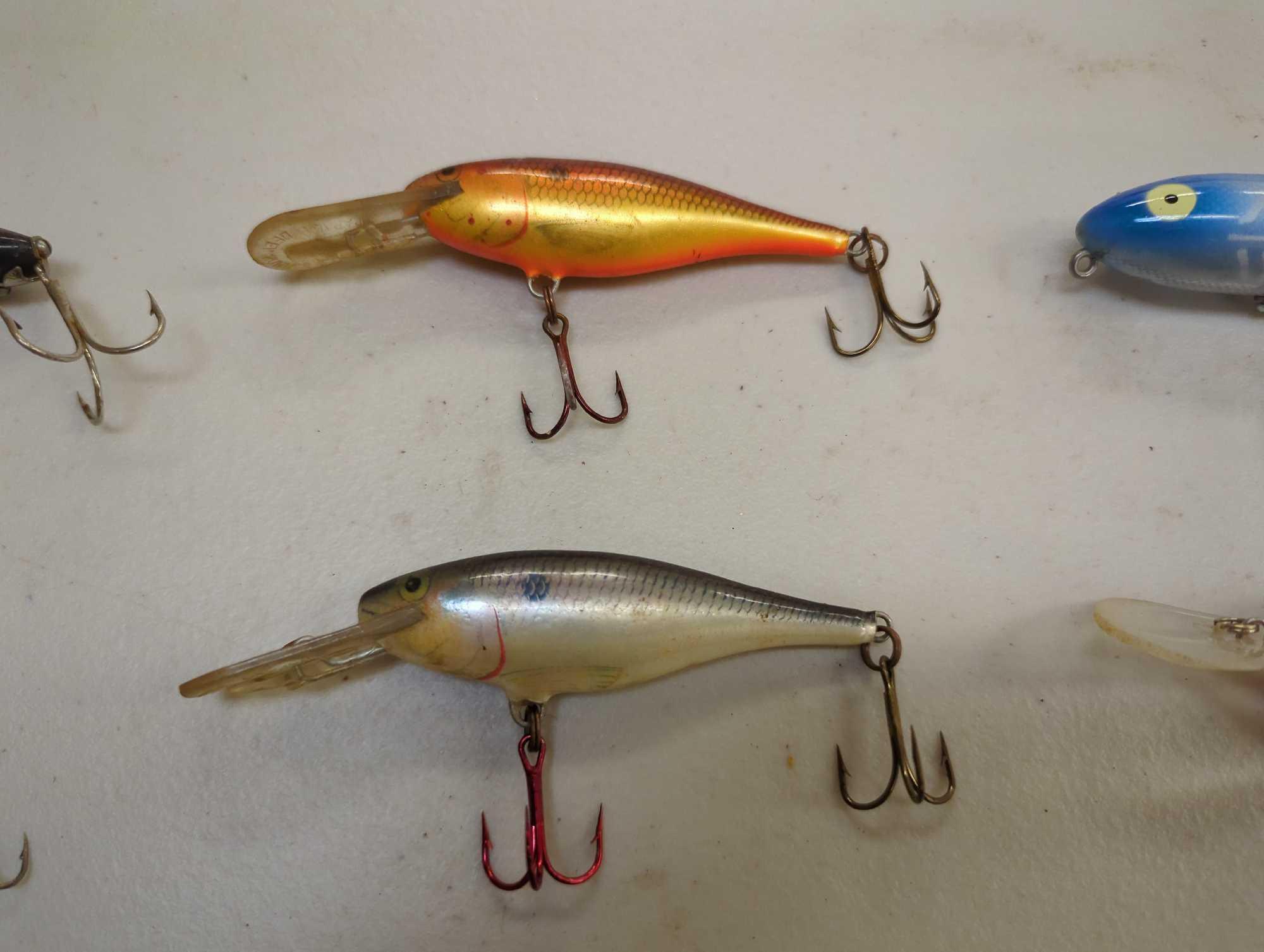 Tackle Box and contents including various fishing lures of similar style. Comes as is shown in