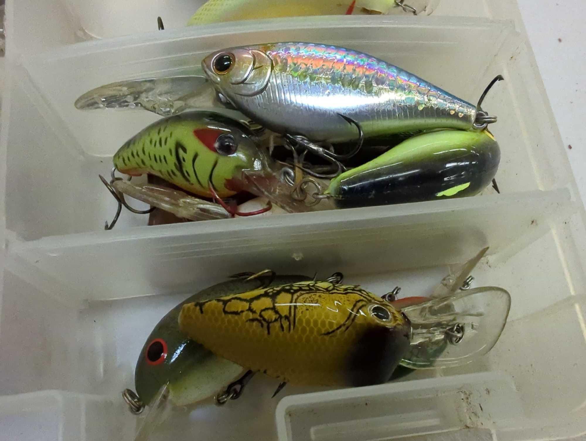 Tackle Box and contents includes fishing lures of similar style. Comes as is shown in photos.