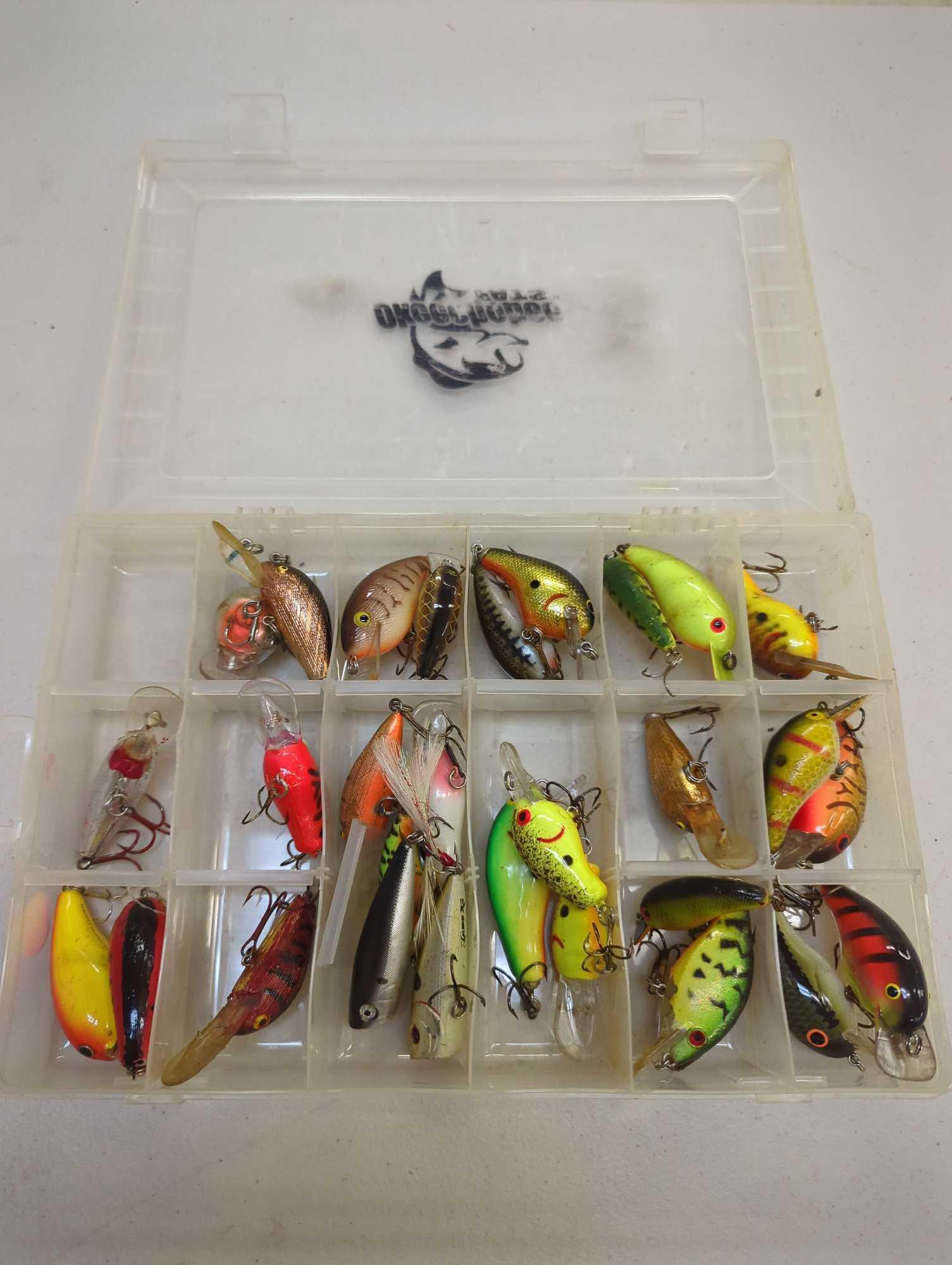 Tackle Box and contents including various fishing lures of similar style. Comes as is shown in