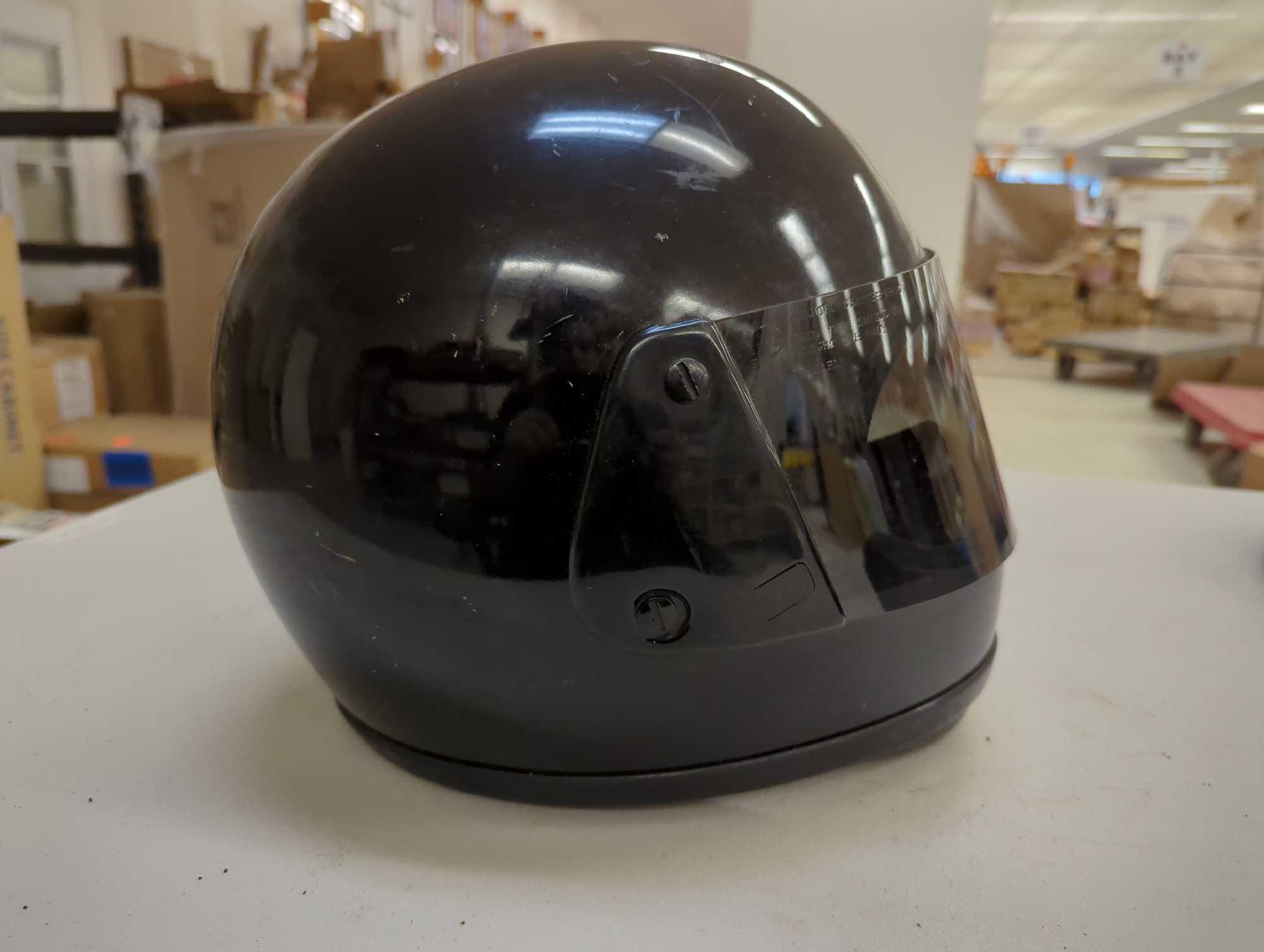 Arai Astro Snell '80 black helmet. Comes with navy blue helmet cover and black Thinsulate insulation