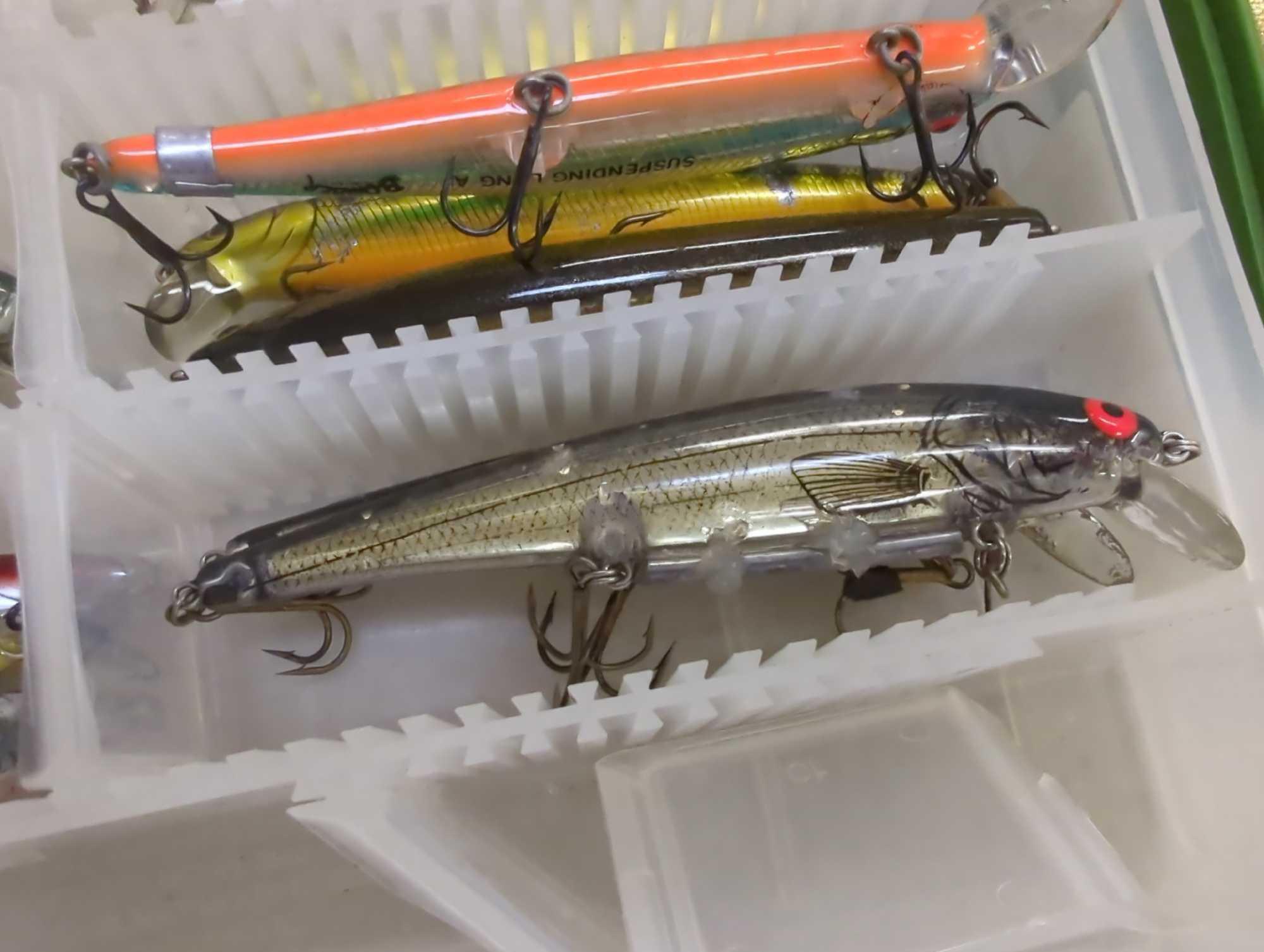 2 small tackle boxes containing fishing lures of similar style. Comes as is shown in photos. Appears