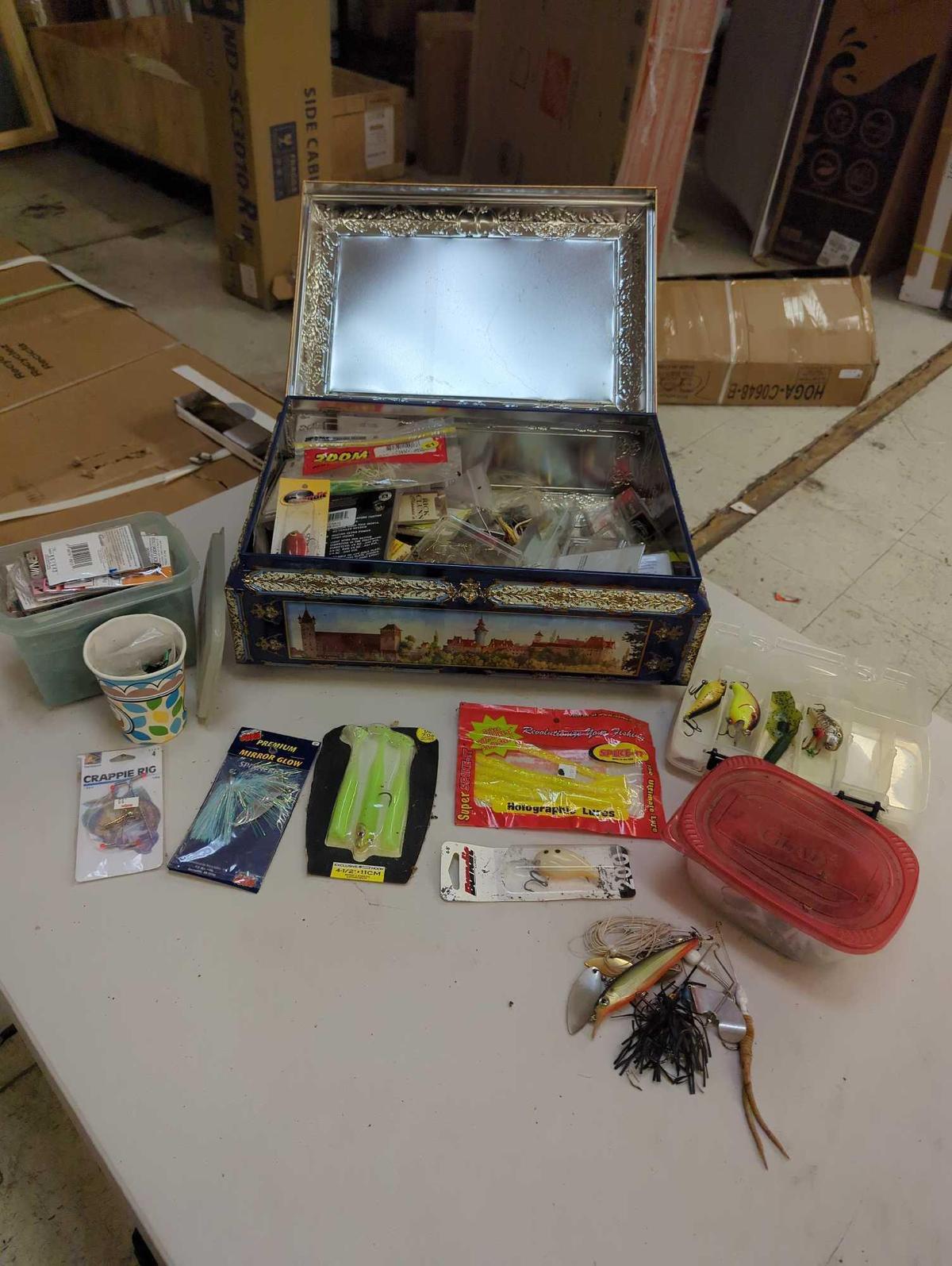 Large tin and contents including various fishing lures and fishing accessories. Comes as is shown in