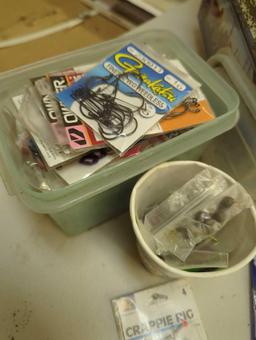 Large tin and contents including various fishing lures and fishing accessories. Comes as is shown in