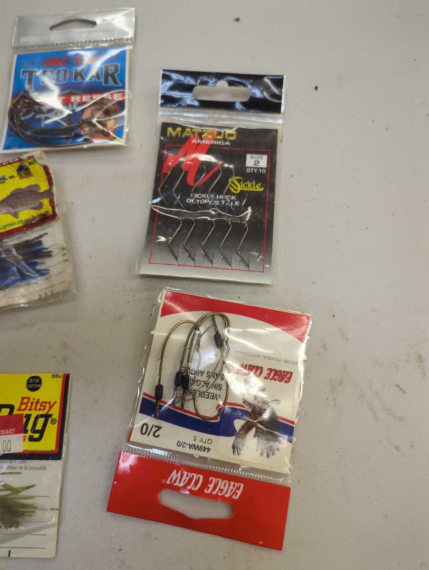 Box and contents including fishing lures and other fishing accessories. Comes as is shown in photos.