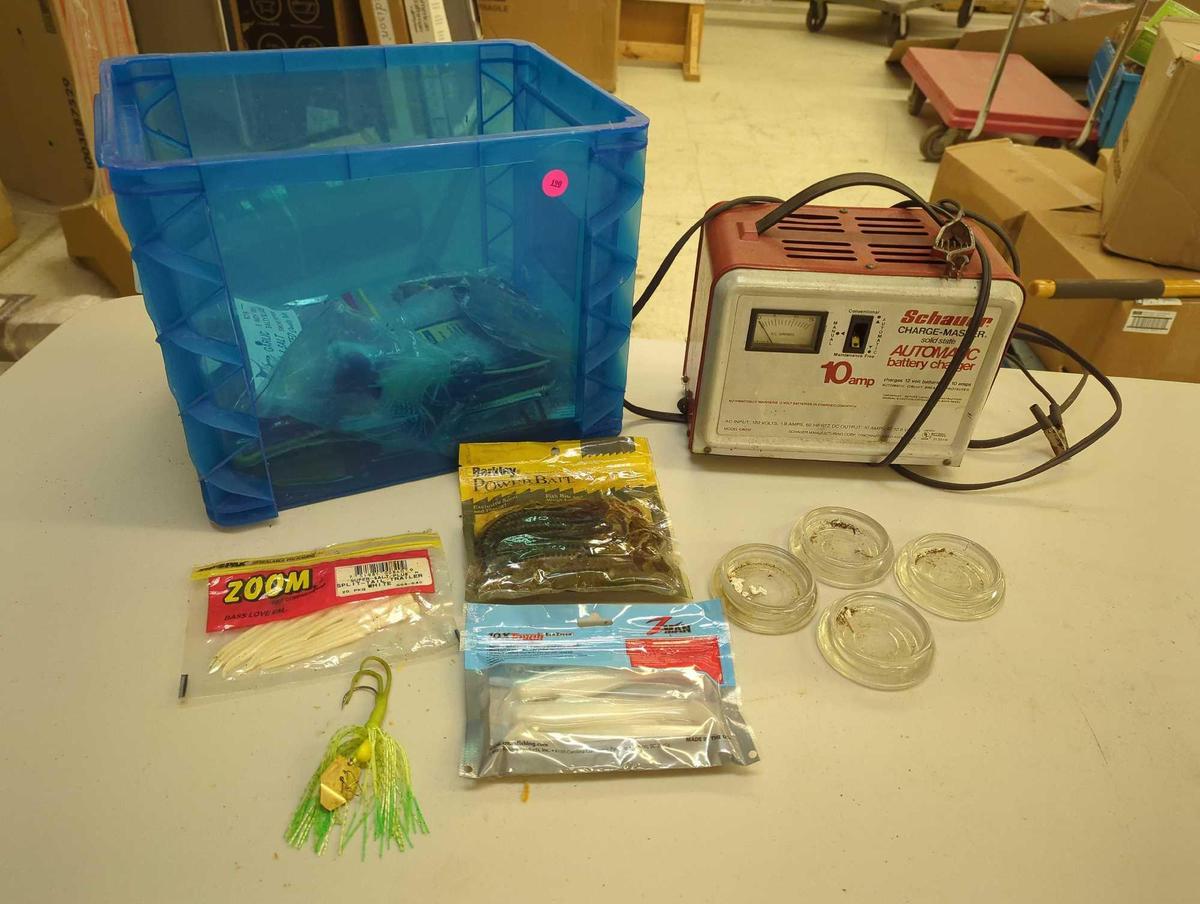 Storage bin of fishing lures, Schauer chargemaster automatic battery charger-10 amp, and glass