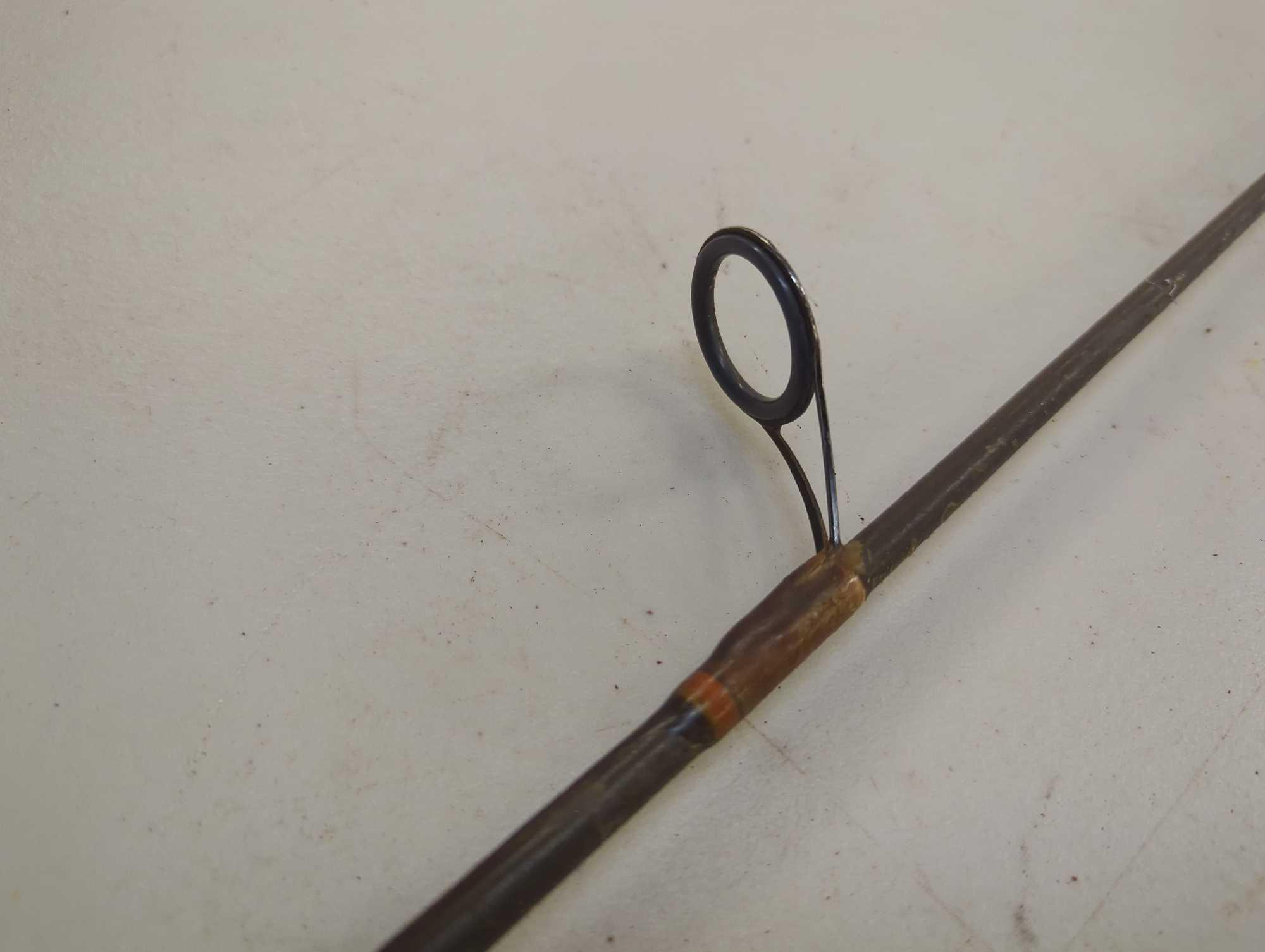 Brown 5'2" fishing rod with spinning reel. Comes as is shown in photos. Appears to be used.