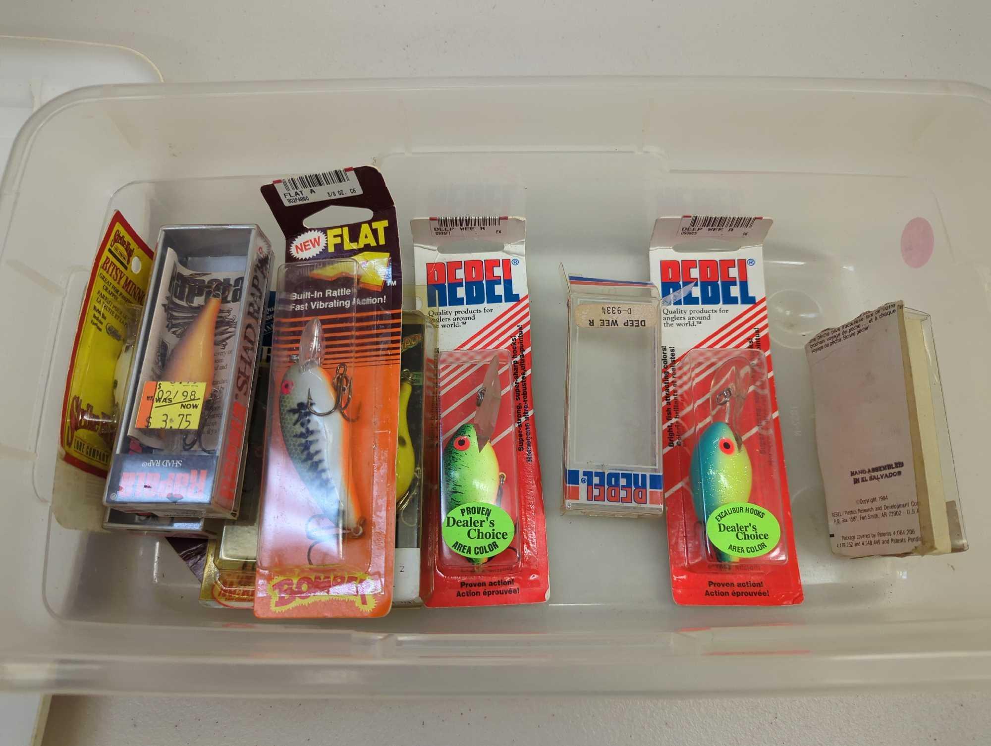 White Sterilite organizer tote filled with packaged fishing lures. Comes as is shown in photos.