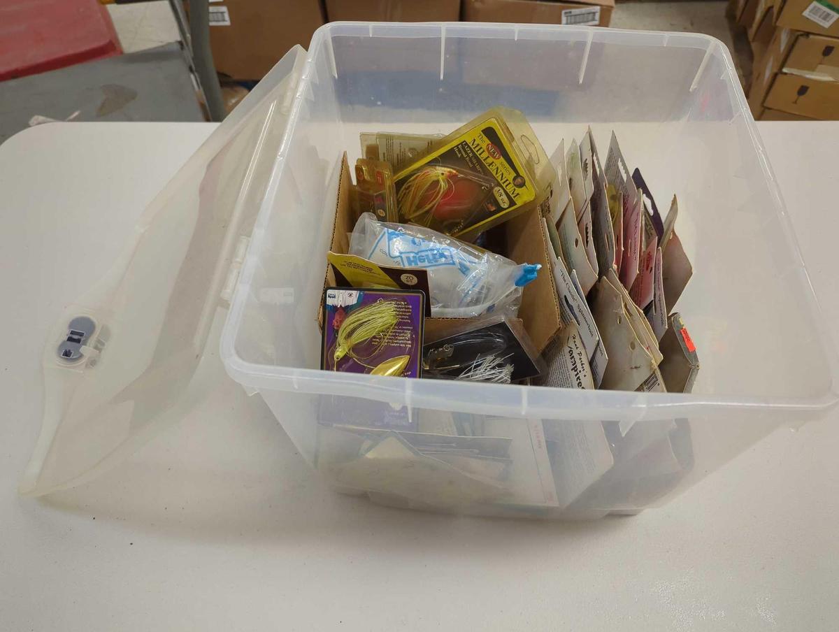 Clear organizer tote and contents including various fishing lures and other fishing accessories.