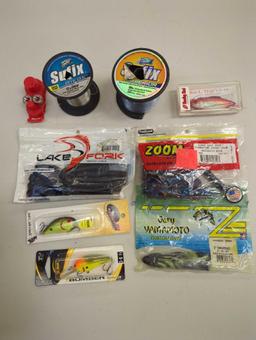 Box of fishing lures and other various fishing accessories. Comes as is shown in photos. Appears to