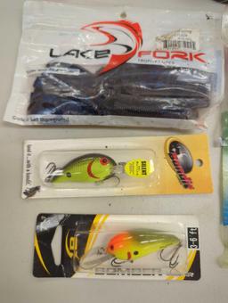 Box of fishing lures and other various fishing accessories. Comes as is shown in photos. Appears to