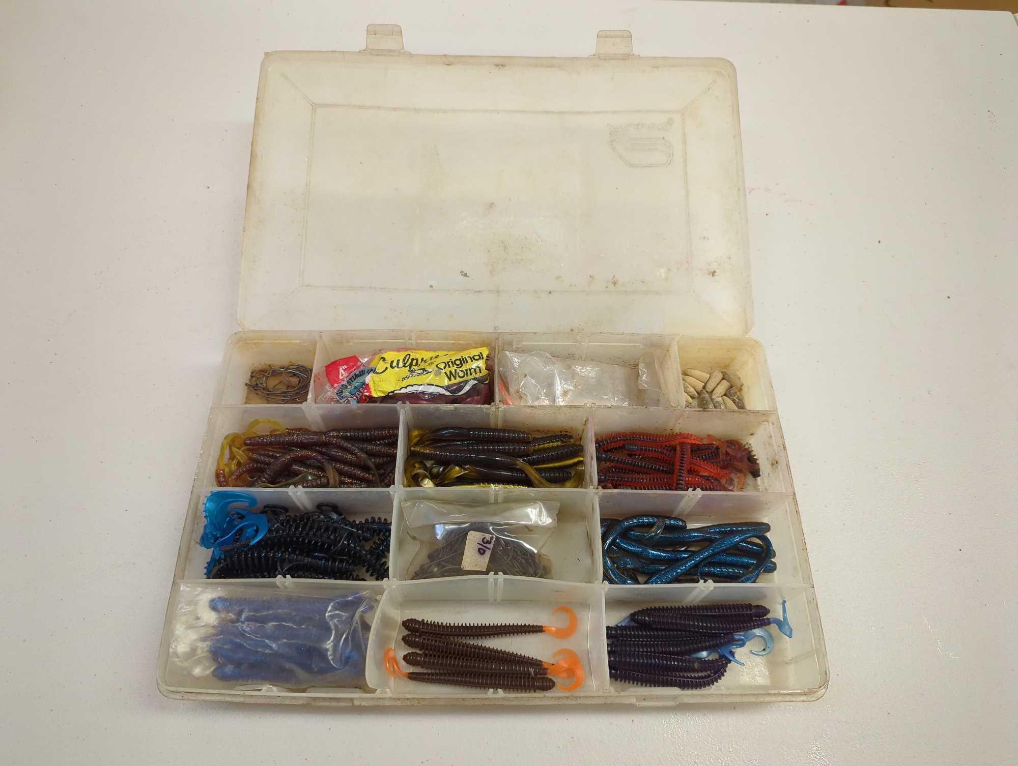 Tackle Box and contents including various fishing lures and other fishing accessories. Comes as is