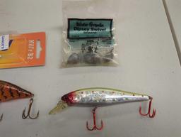 Tackle Box and contents including various fishing lures and other fishing accessories. Comes as is