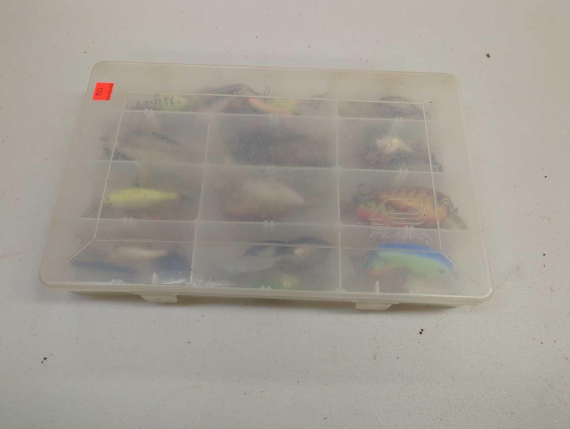 Tackle Box and contents including various fishing lures of similar style. Comes as is shown in