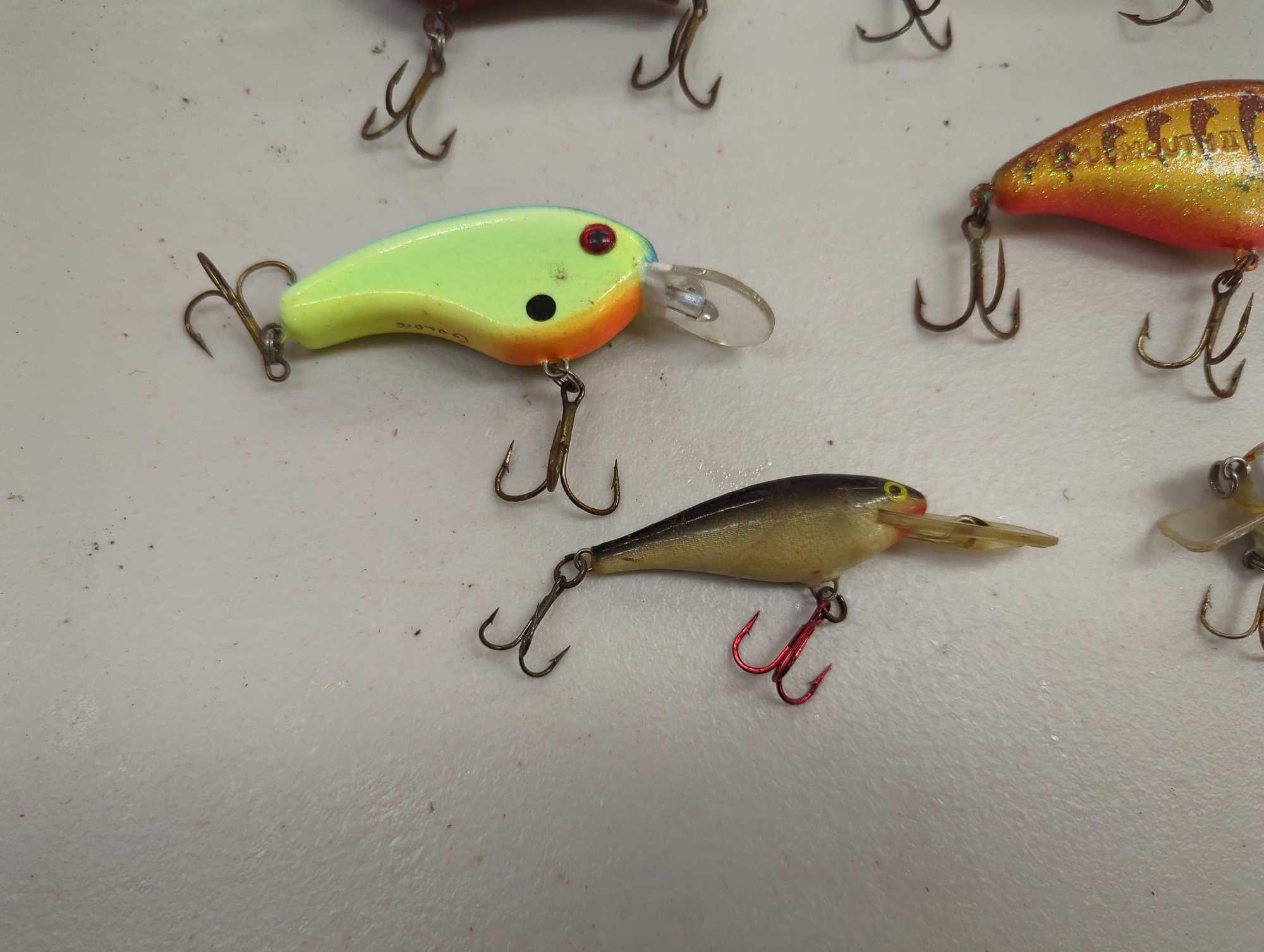 Tackle Box and contents including various fishing lures of similar style. Comes as is shown in