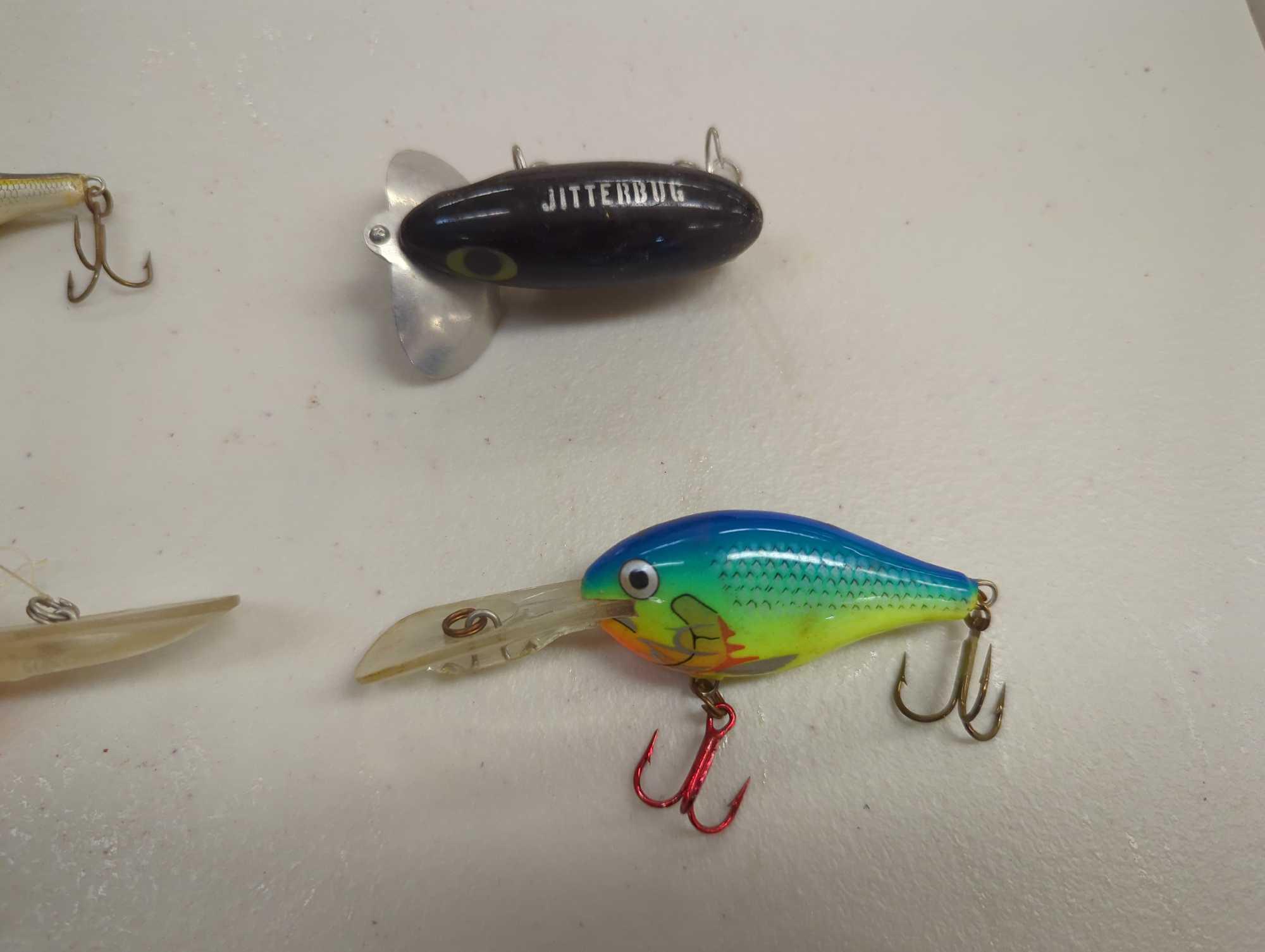 Tackle Box and contents including various fishing lures of similar style. Comes as is shown in