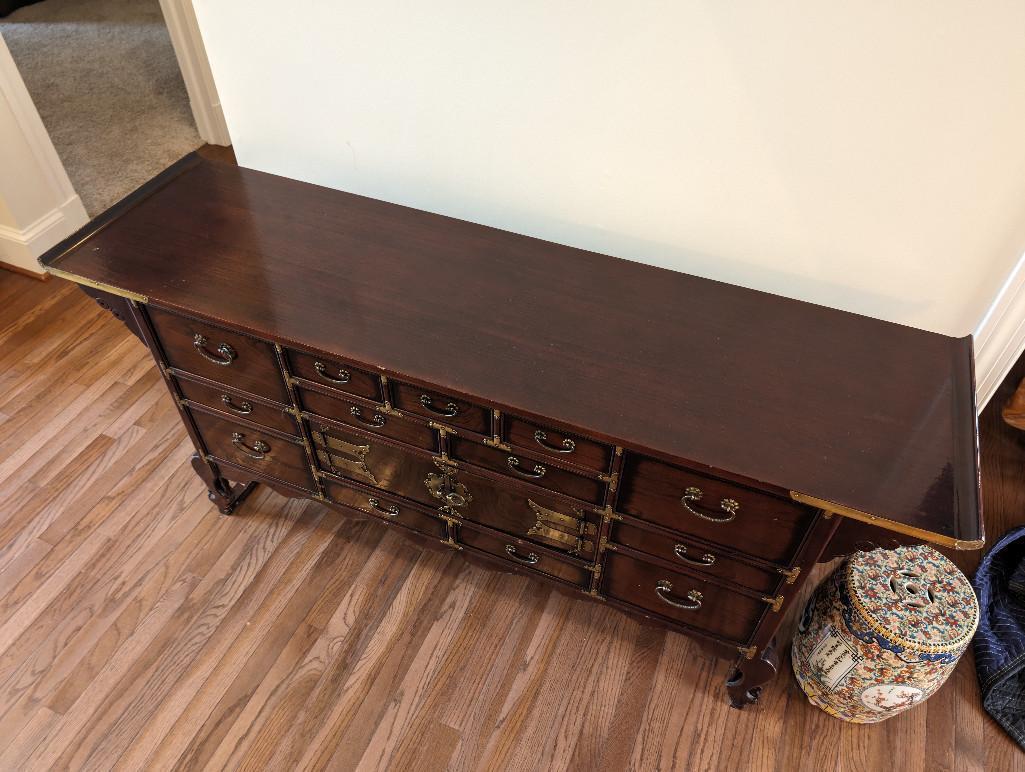 KOREAN BRASS ACCENTED BUFFET/SIDEBOARD. FEATURES MULTIPLE DRAWERS AND SINGLE CABINET.