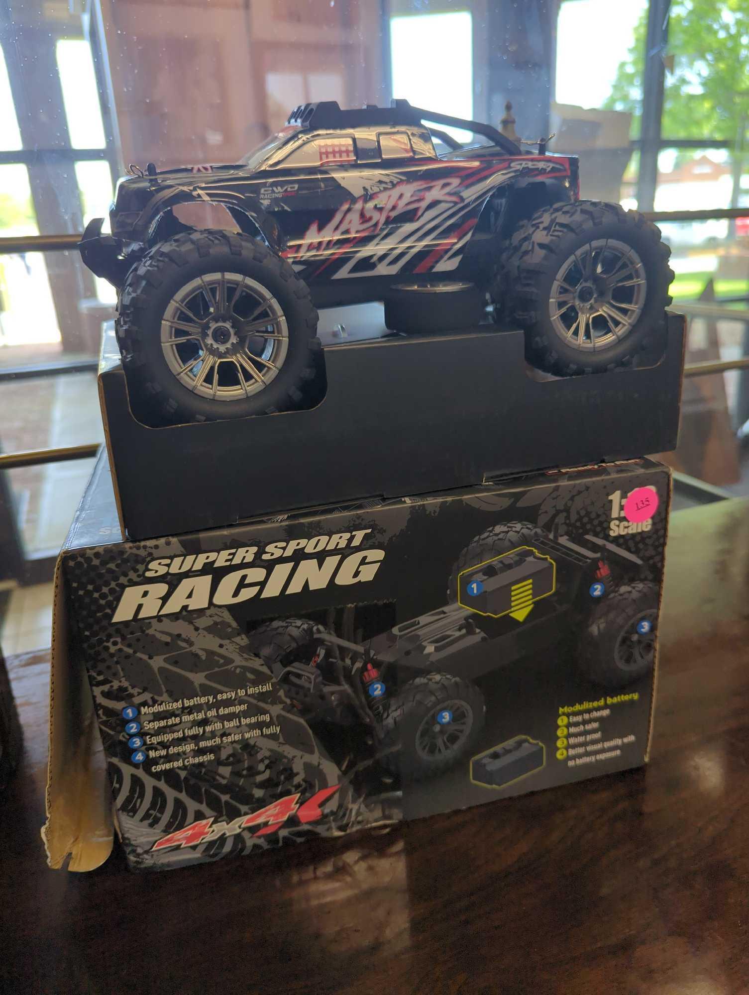 SUPER SPORT RACING RC 4X4, OPEN BOX, UNIT APPEARS NEW, THE CONTROLLER IS STILL ZIP TIED,