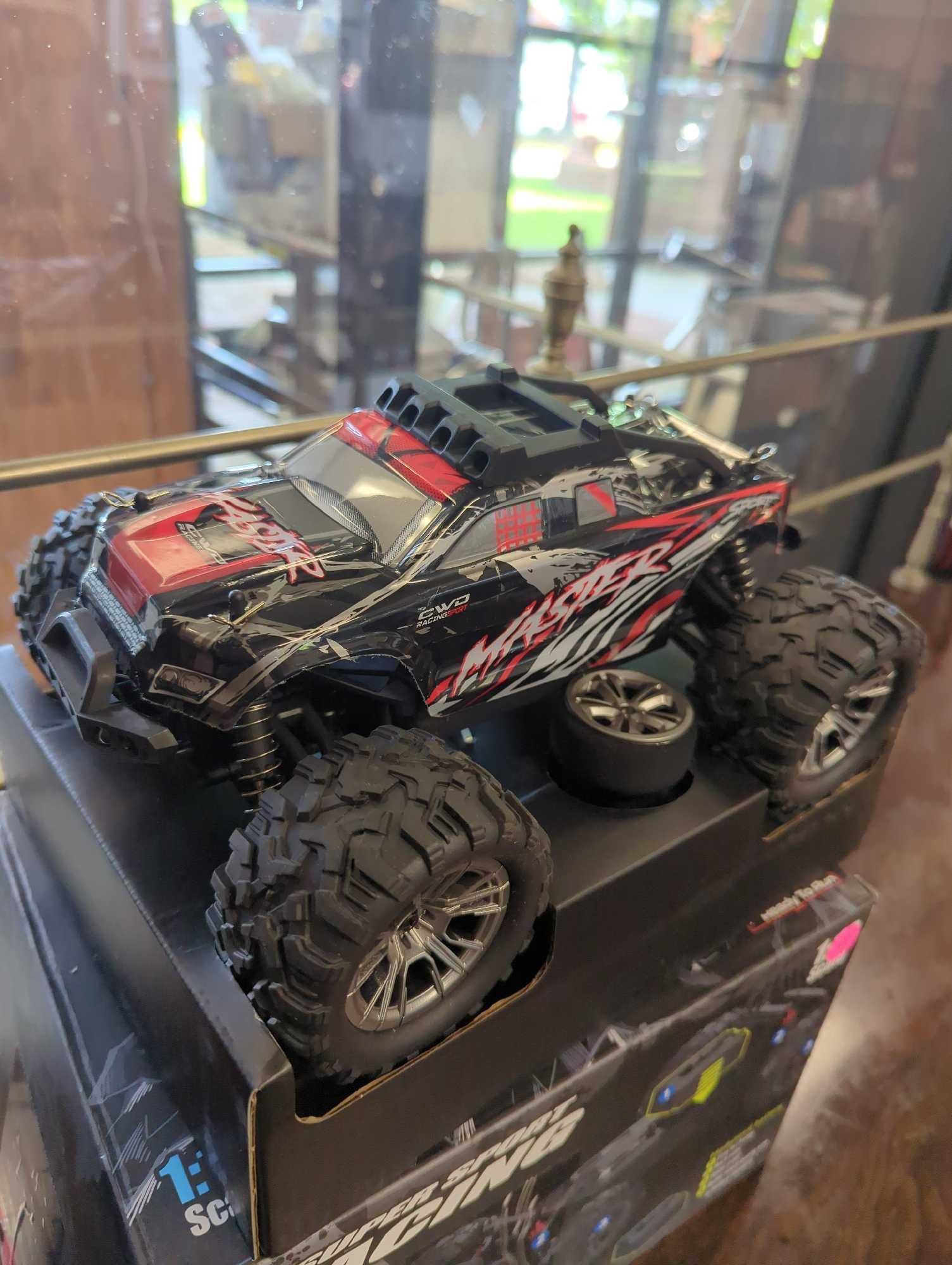 SUPER SPORT RACING RC 4X4, OPEN BOX, UNIT APPEARS NEW, THE CONTROLLER IS STILL ZIP TIED,