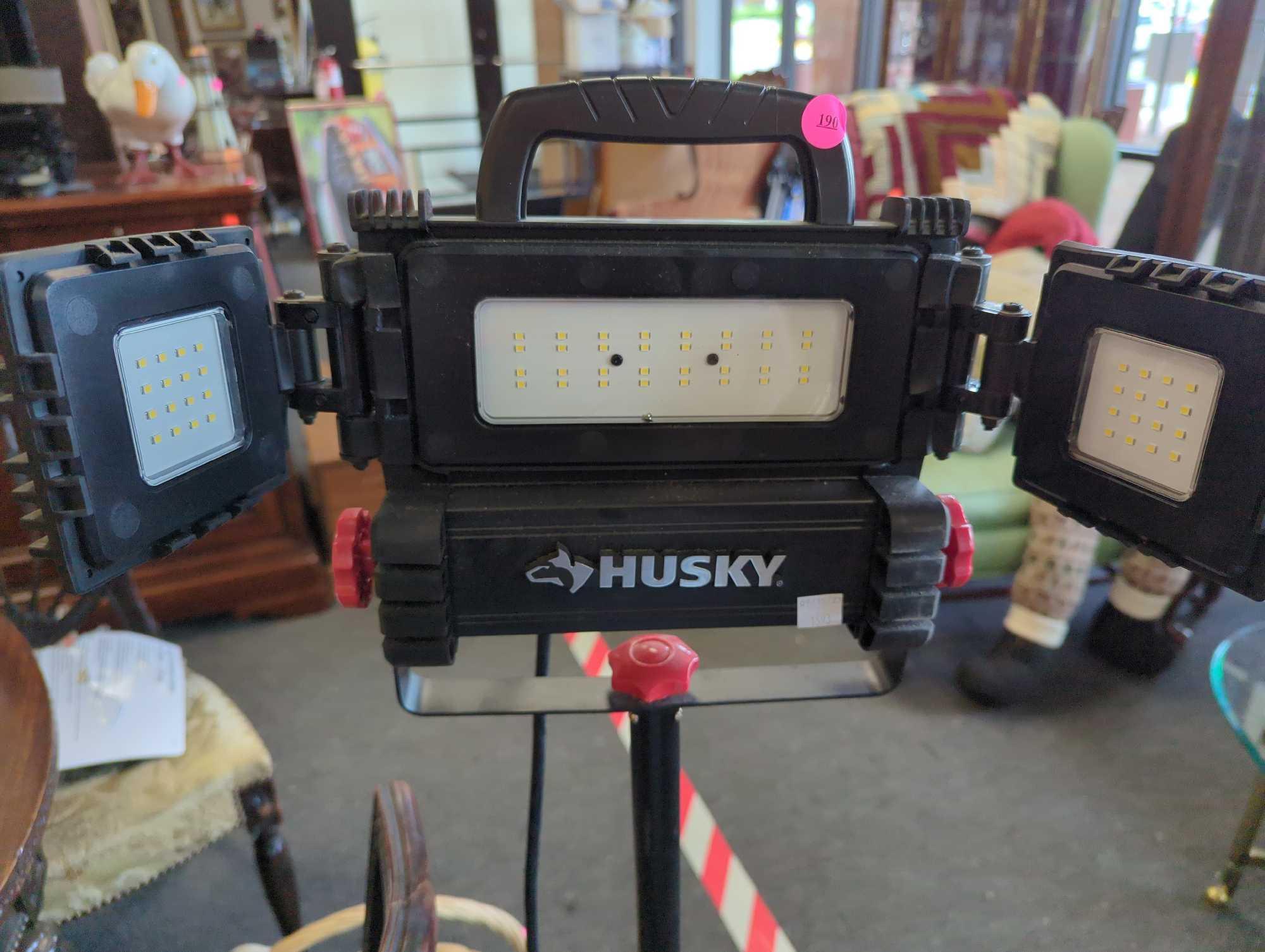 Husky 7000 lumen multi directional led tripod work light, Measure Approximately 51 inches Tall.
